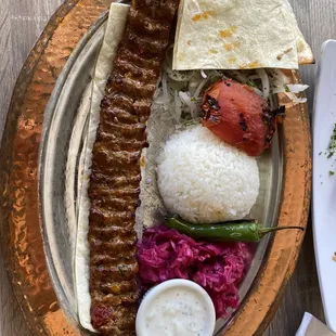 a plate of meat and rice