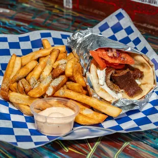 Fresh-ingredients Gyro pita wrap with fries; simply Greek.