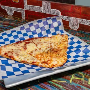 Our new homemade cheesy pizza! 
Ask us for extra toppings.