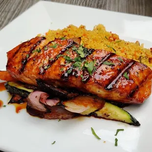 a plate of food on a wooden table
