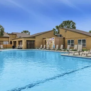 Residents can enjoy community amenities including free covered parking, a playground, and two sparkling swimming pools