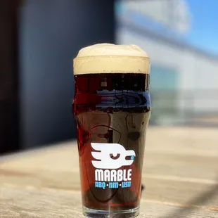 a glass of beer on a table