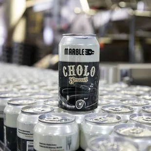 a can of chocolate stout on a conveyor belt