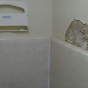 The damaged wall.