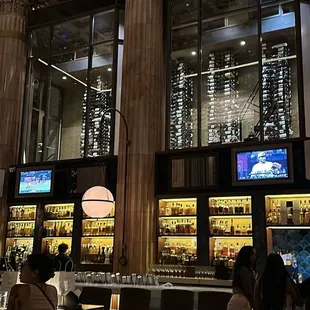 The wine cellar upstairs, and the bar below