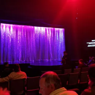 Stage, pretty funny show. 20volunteers, 5-6 most hypnotized stay on stage. Great value would do again.