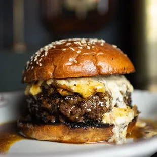 a cheeseburger on a white plate