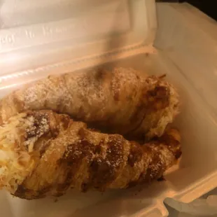 a pastry in a styrofoam container