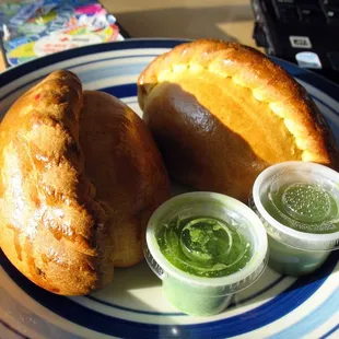 a plate of bread and dips