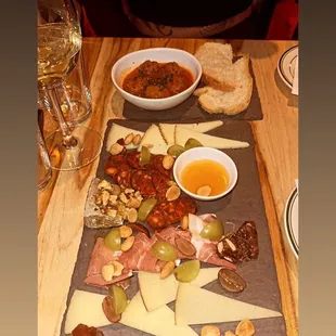 Spanish cheese board selection add prosciutto and Spanish sausage