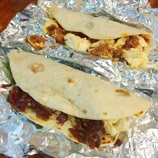 Bottom one is bacon and egg. Top one is chorizo and egg.