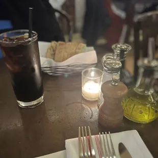 a glass of soda and a plate of food