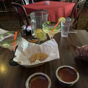 Chips and salsa and empty pitcher of margaritas