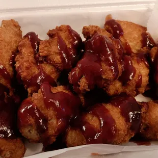 BBQ wings. Wings are breaded and deep fried.