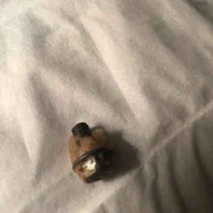 a bottle of wine on a bed