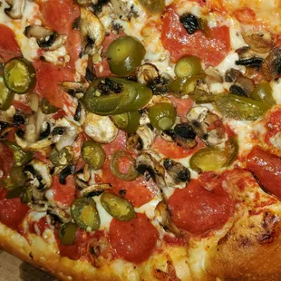 pepperoni, mushrooms, olives, and cheese