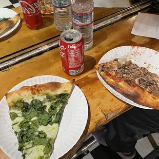 Spinach/pesto pizza and mushroom sausage pizza