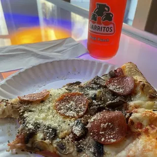 Single bite out of single slice of pepperoni!