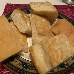 a plate of bread slices on a table
