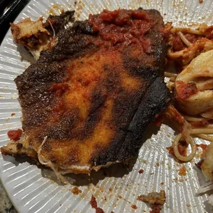 a plate of pasta and meat