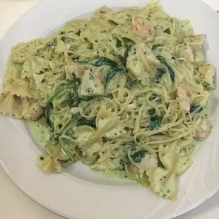 Creamy Pesto pasta, chicken, shrimp, spinach with angel hair and bow tie. So good!