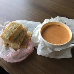 I couldn&apos;t make it one day so a coworker grabbed this for me .. Thanks Toni .. To go Tomato Basil Soup with bread .. Slap Yo Momma Good !!!