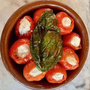 Stuffed peppadew peppers with goat cheese and fried basil
