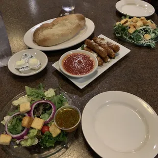 Mozzarella sticks, salads and bread