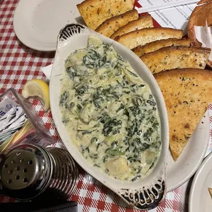 Spinach artichoke dip unbelievable how creamy and delicious it was with pita chips