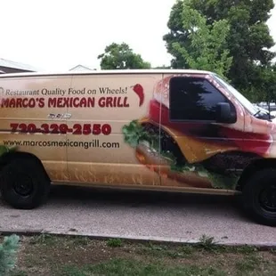 a van parked in front of a house