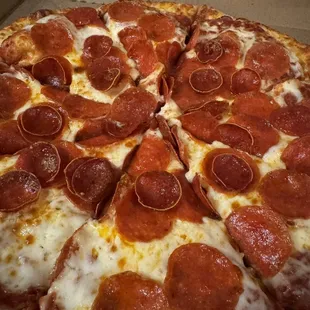 a pepperoni pizza in a box