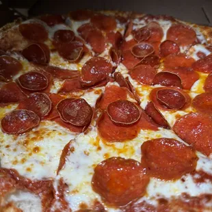 a pepperoni pizza in a box
