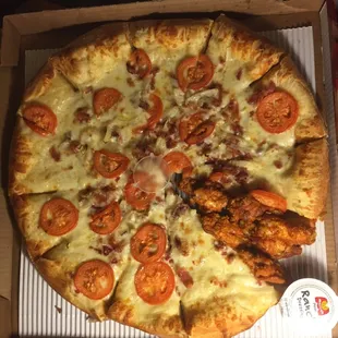 A white pizza with six tiny wings in place of a slice, the pizza is very very great, I mean freaking good!