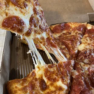 a slice of pepperoni pizza