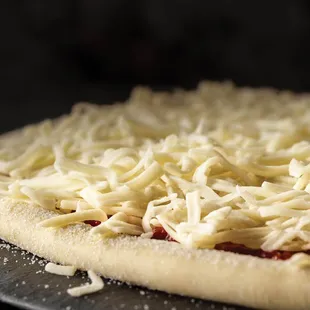 a pizza covered in cheese