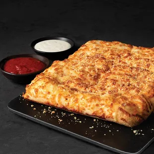 a cheesy pizza with sauce