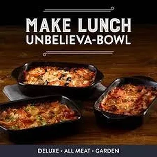 three pans of food on a table