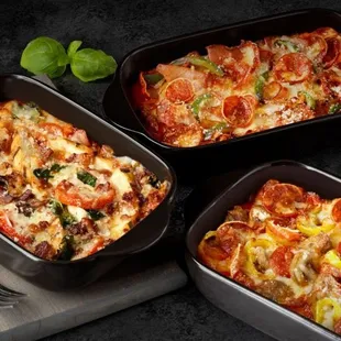 three pans of pizza