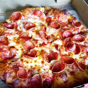 a pepperoni pizza in a box