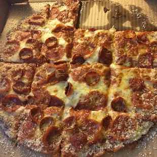 a pepperoni pizza in a box