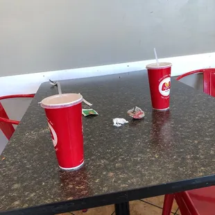 two red cups on a table