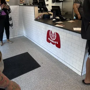 a man sitting in front of a counter