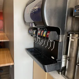 a soda dispenser in a restaurant