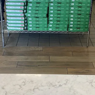 a rack of pizza boxes