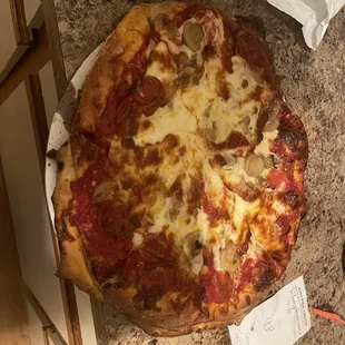 a whole pizza on a plate