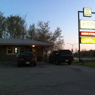 a car parked in front of a restaurant