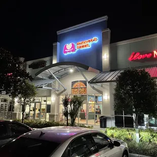 a car parked in front of a restaurant