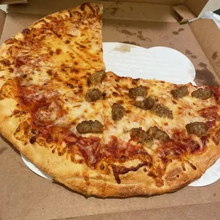 a half eaten pizza in a box