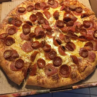 a pepperoni pizza in a box
