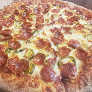 a pepperoni and jalapeno pizza